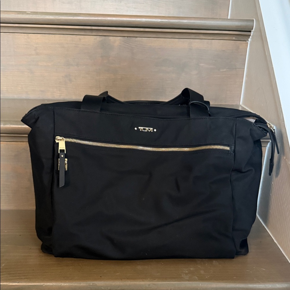 Tumi Black Duffel Bag with Gold Accents